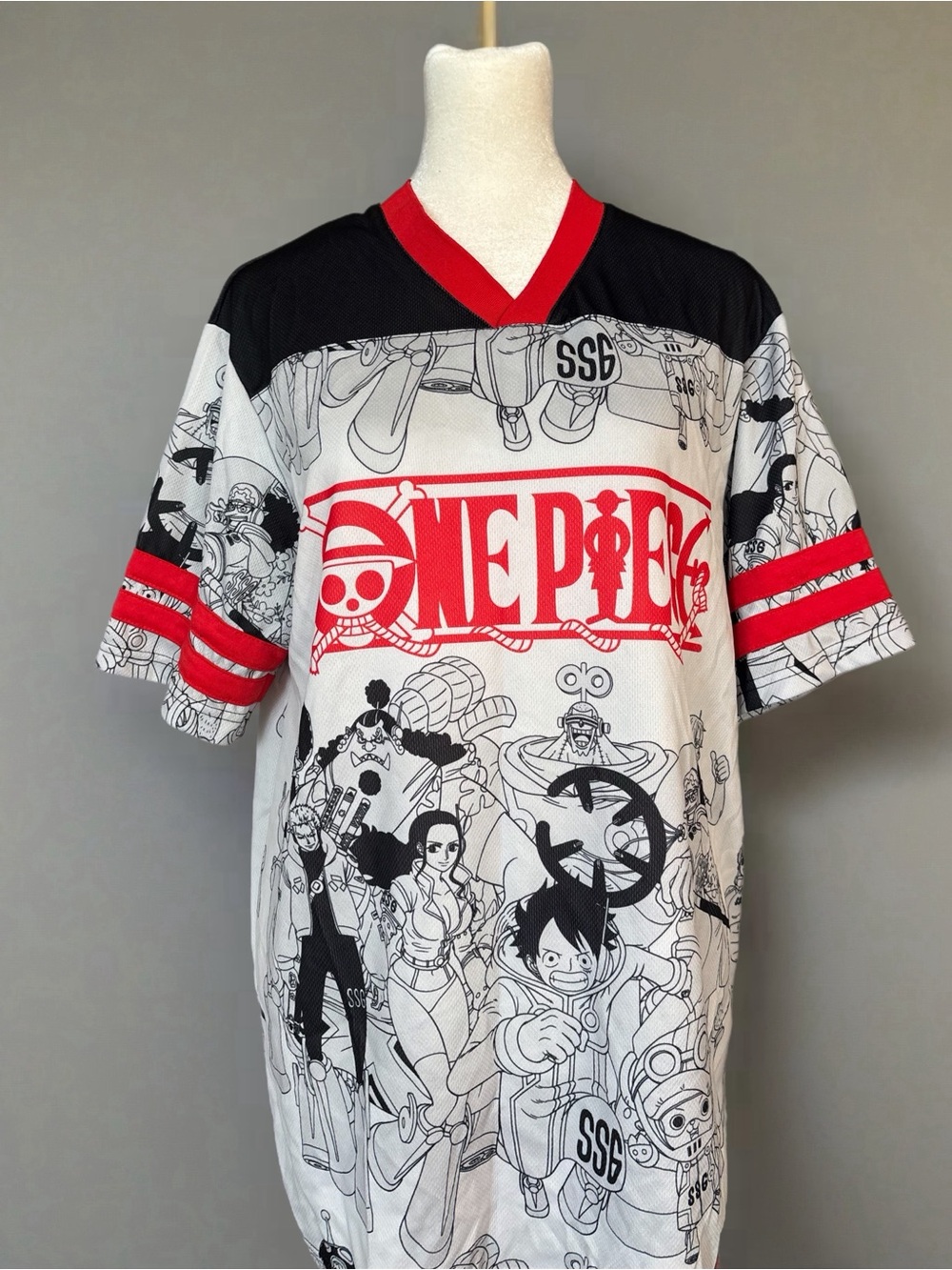 Source Unknown One Piece Graphic V-Neck Tee in White, Black and Red